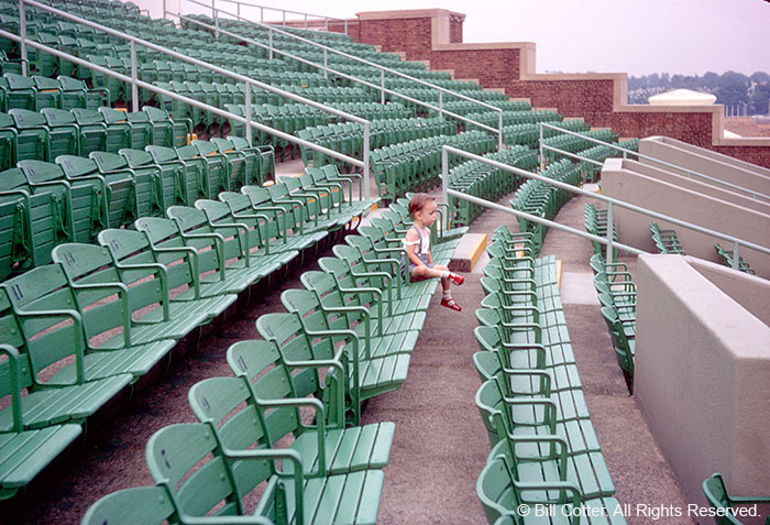 Boy in empty seats